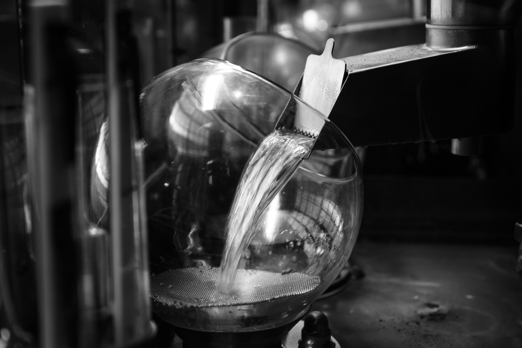 A close view of liquid being poured into a measuring vessel at Ardbeg
