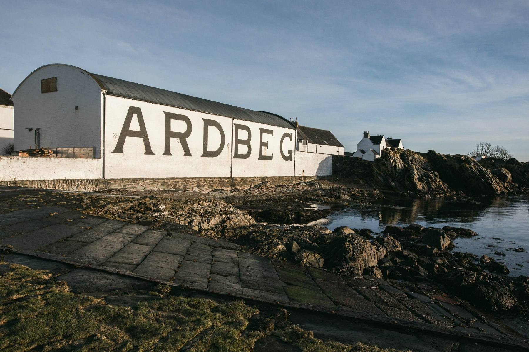 Ardbeg’s whitewashed warehouse beside the rocky shoreline