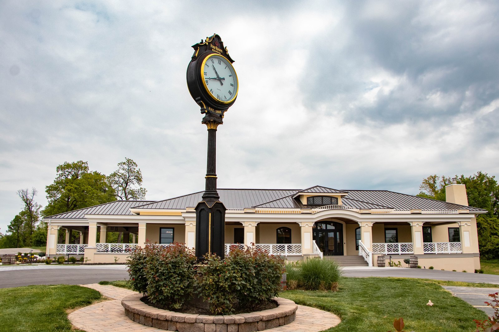 Four Roses visitor centre and clock outside the entrance