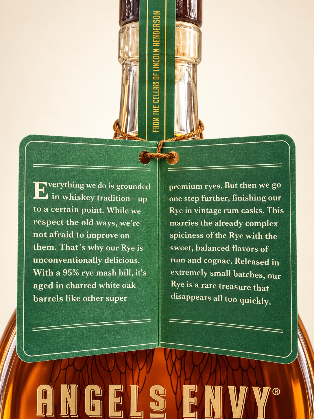 AI-retouched green Angel’s Envy hangtag describing a 95 percent rye mash bill and vintage rum-cask finishing